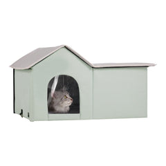 Green heated cat house with waterproof fabric, thermal insulation, and dual exits for easy access.