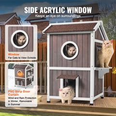 2-story outdoor cat house made of cedar wood with a triangular asphalt roof and large doors.