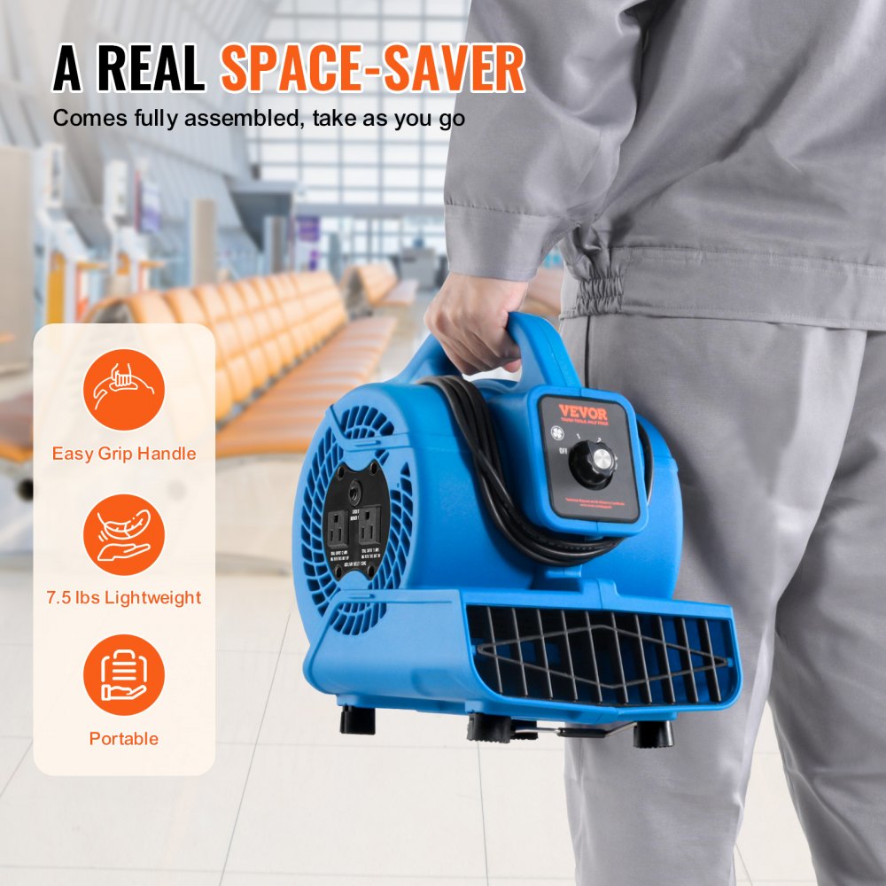 Blue Bostome floor blower with handle, held by a person in an airport.