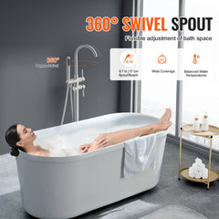 Brushed brass freestanding bathtub faucet with 360-degree swivel spout and handheld shower mounted beside a white tub.