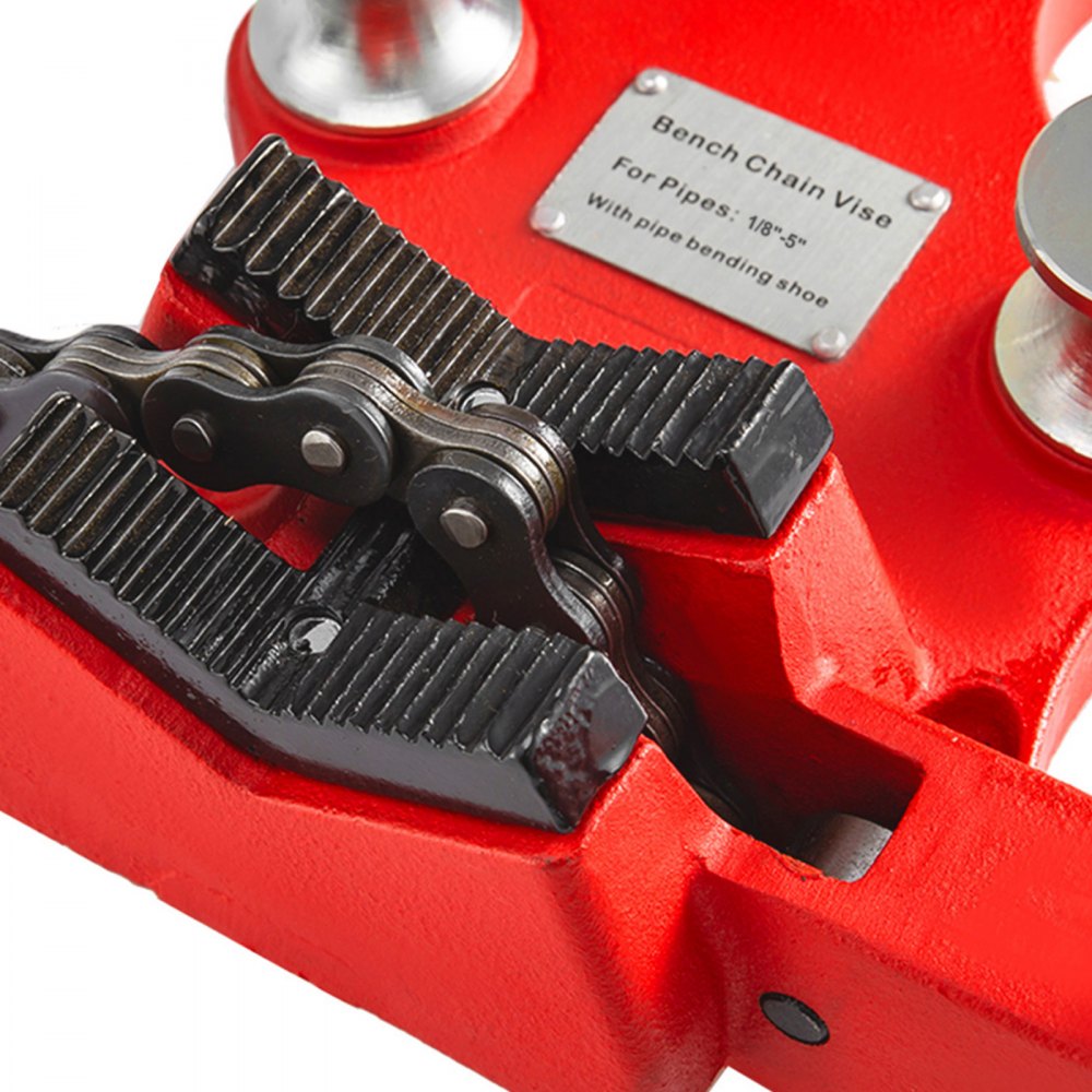 Red cast iron bench chain pipe vise with black chain jaws for 1/8-5 inch pipes.
