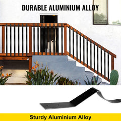 Black aluminum alloy deck balusters, 32.25 inches tall, shown installed on a wooden staircase with plants nearby.