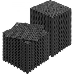 Stack of 50 black PVC interlocking drainage floor tiles, each 12x12 inches.