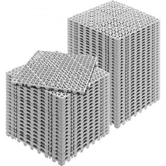 Gray PVC interlocking drainage tiles, 12x12 inches, designed for efficient water flow and safety.