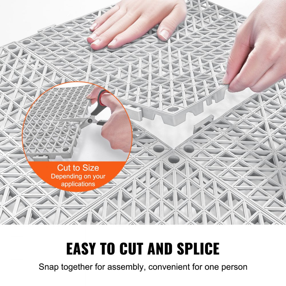 Gray PVC interlocking drainage tiles, 12"x12", designed for efficient water flow and slip resistance.
