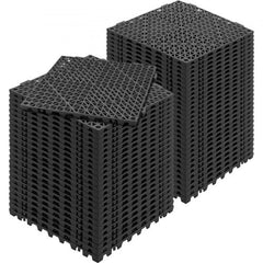 Stack of 55 black PVC interlocking drainage floor tiles, each 12x12 inches.