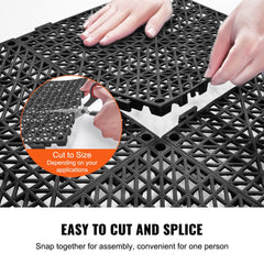 Black PVC interlocking drainage floor tiles with textured surface and snap-together edges.