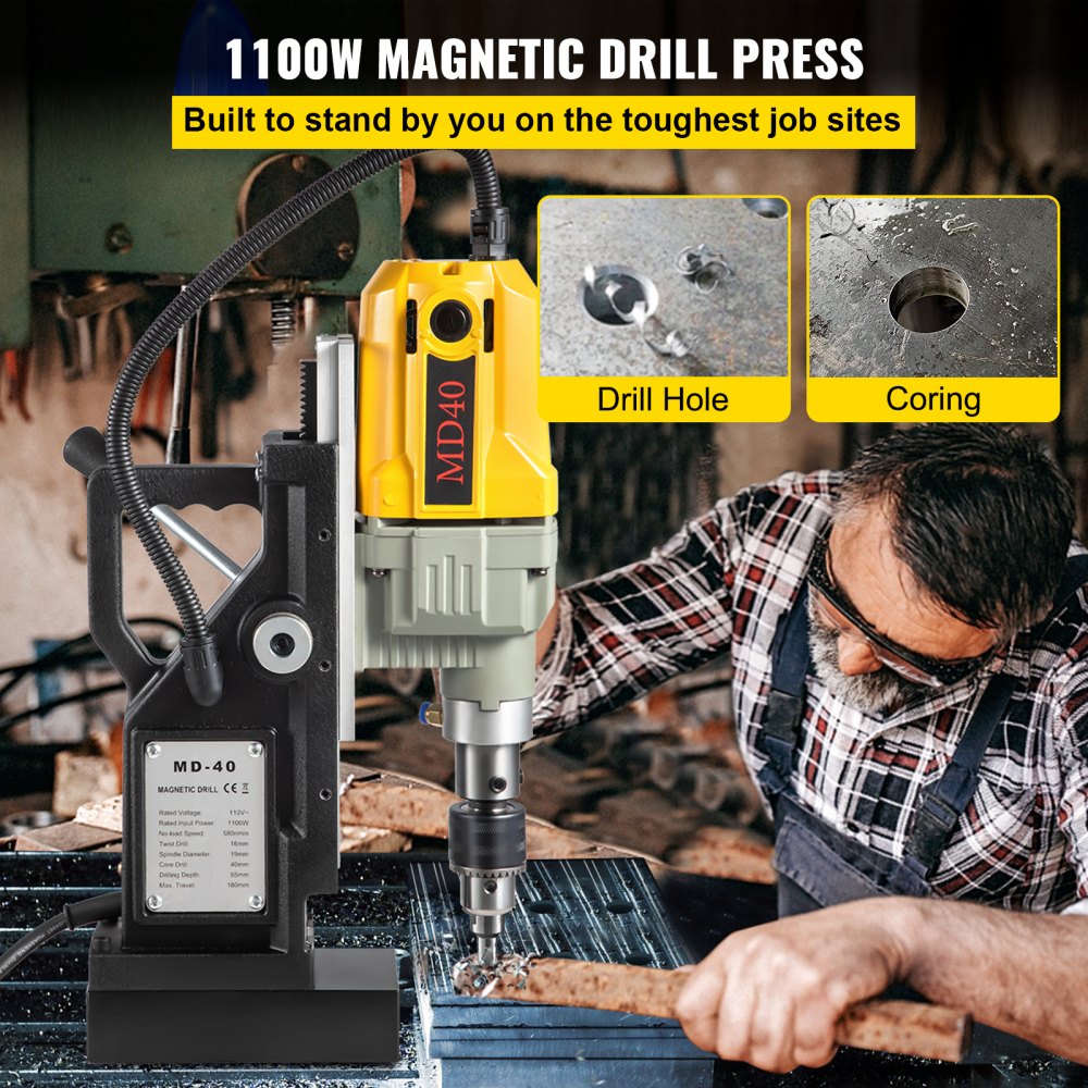 Yellow 1100W magnetic drill press with base, used by a man to bore holes in steel.