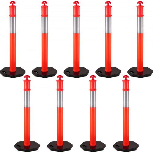 Nine orange 44-inch traffic delineator posts with reflective bands and weighted rubber bases.