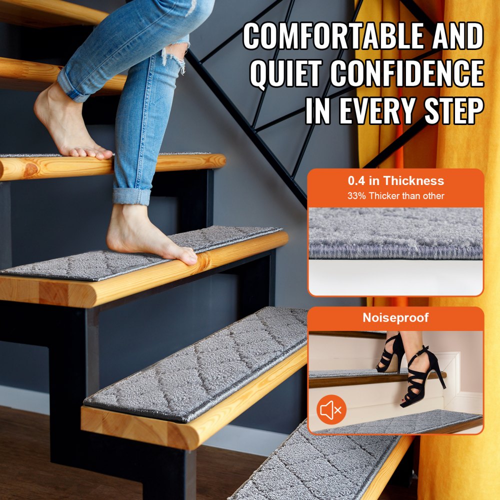 A person walks barefoot on gray, diamond-patterned stair treads on wooden stairs.