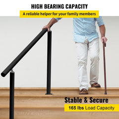 A man in a checkered shirt grips a black adjustable aluminum stair handrail on wooden steps while holding a cane.