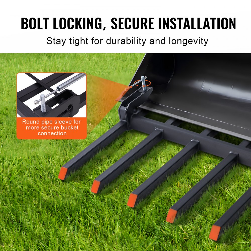 Close-up of Bostome clamp-on debris forks with six reinforced steel tines on green grass background.