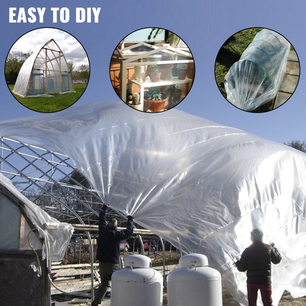 Workers installing 15x40 ft UV-resistant greenhouse polyethylene film over a metal frame structure.