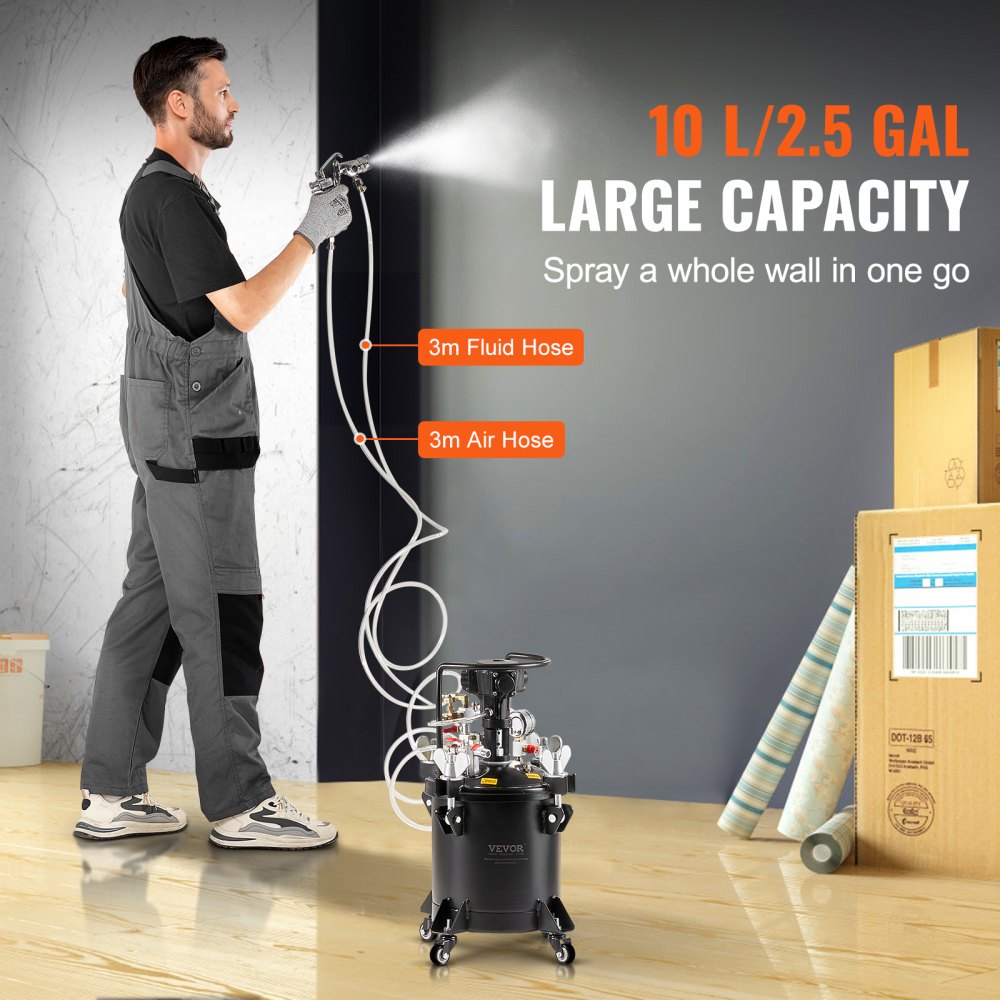 A man uses a black 10L spray paint pressure pot with 3m fluid and air hoses to paint a wall.