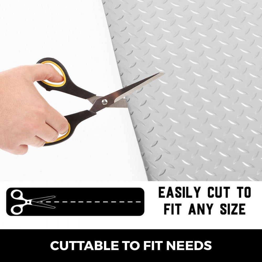 Silver PVC garage floor mat shown being cut with scissors to fit any size.