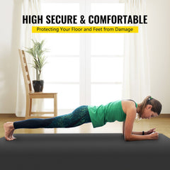 A woman performs a plank on a grey and black non-slip PVC dance floor roll in a living room.