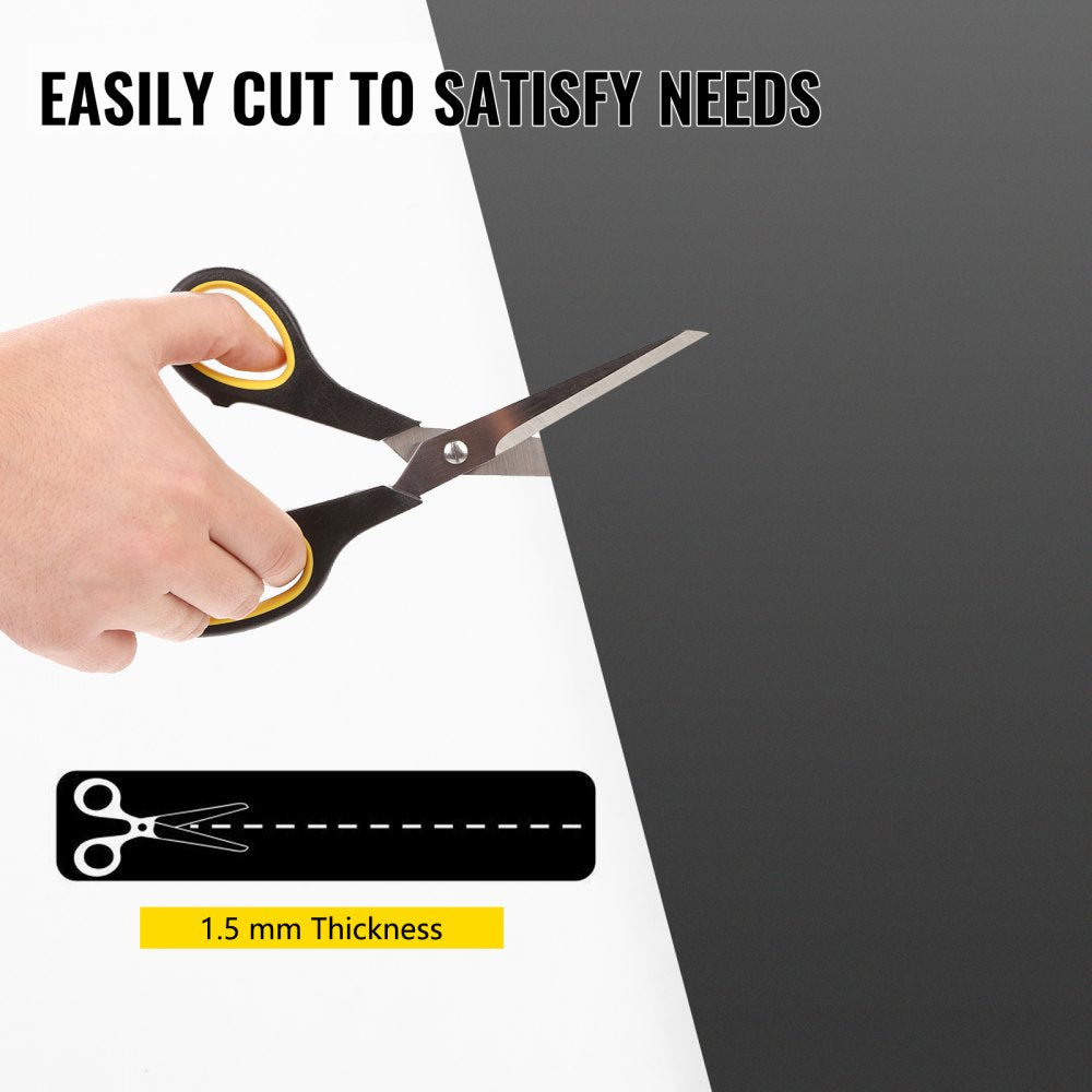 Hand cutting a 1.5mm thick grey/black PVC dance floor roll with scissors.