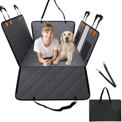 Gray waterproof dog car seat cover with hammock sides, showing a girl and golden retriever inside, plus straps and storage bag.