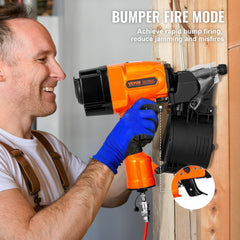 Man using orange Bostome MCN90 coil framing nailer on wood in bump-fire mode.
