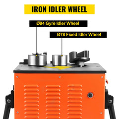 Orange electric rebar bender with iron idler wheels and control lever on black base.