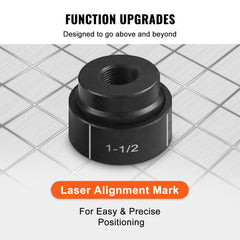 Close-up of black 1-1/2 inch knockout punch die with laser alignment mark on grid surface.