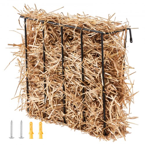A black metal wall-mounted hay feeder filled with light brown hay, with mounting hardware.