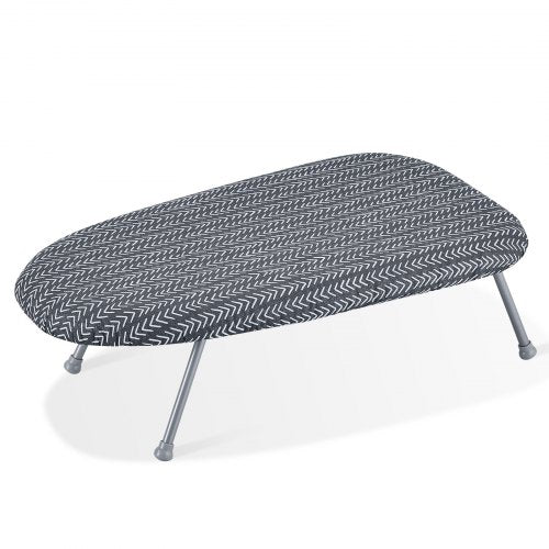 Small tabletop ironing board with heat-resistant cover and foldable design for easy storage.