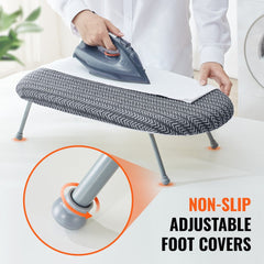 Compact tabletop ironing board with heat-resistant cover and foldable design for easy storage.