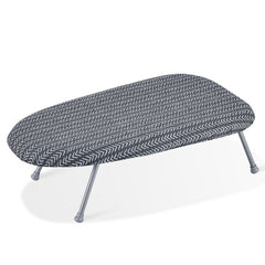 Compact tabletop ironing board with heat-resistant cover and foldable design for easy storage.