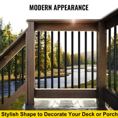 A wooden deck railing with 16 black iron balusters, 44 inches tall, overlooking a river and trees at sunset.