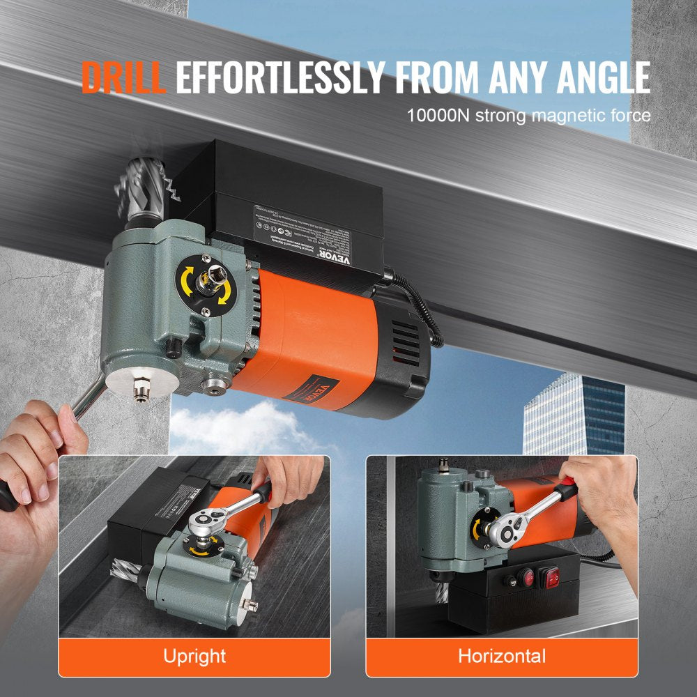 Low-profile magnetic drill press with 1300W motor, orange handle, and black base on steel surface.