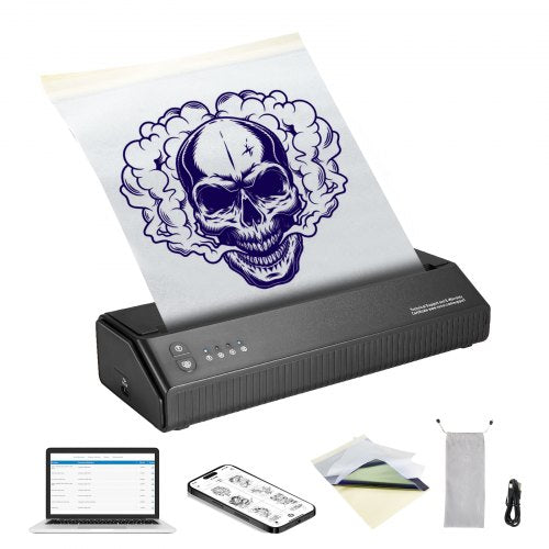 Portable wireless Bluetooth tattoo stencil printer with skull design on transfer paper, laptop, phone, and accessories.
