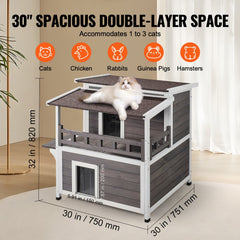 Two-story wooden cat house with a balcony, designed for outdoor feral cats.