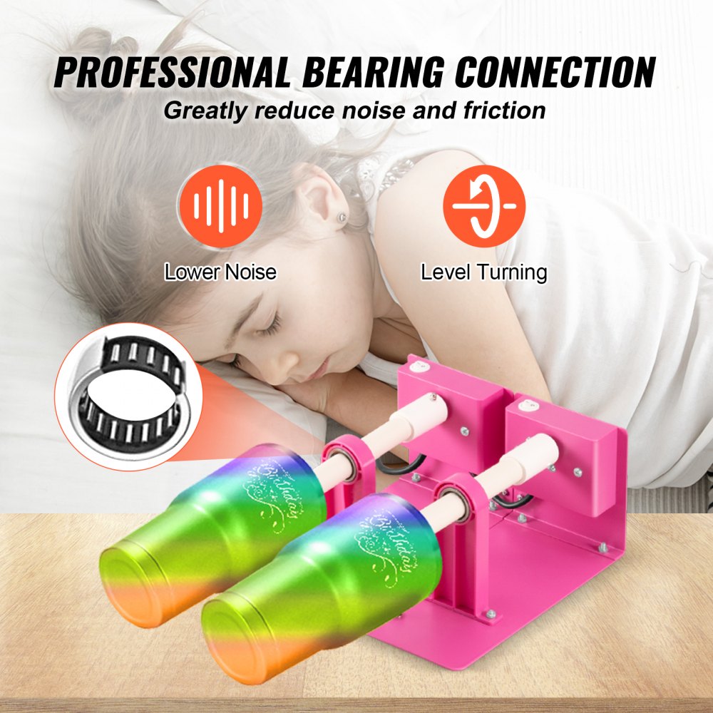 A pink double cup turner with two colorful tumblers on a wooden surface.