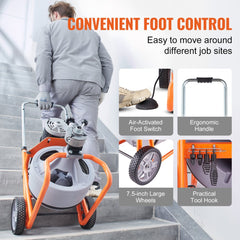 Man pushing orange wheeled drain cleaner machine with 100ft cable and foot pedal on stairs.