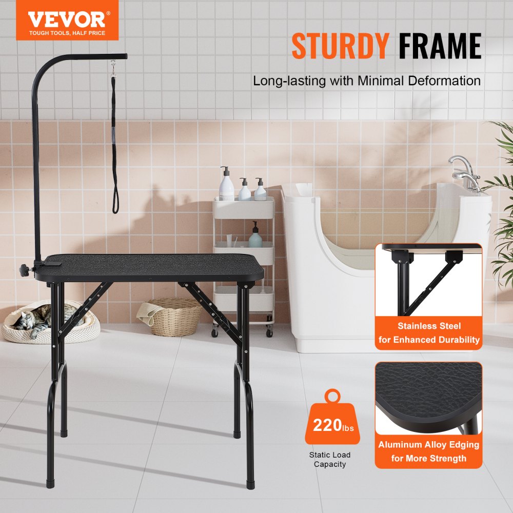 Foldable pet grooming table with black top, stainless steel frame, adjustable arm, and grooming loops.