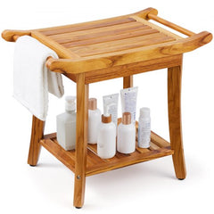 Teak wood shower bench with towel rack and lower shelf holding toiletries on white background