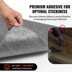 Hand holding a light gray peel-and-stick carpet tile with premium adhesive info.