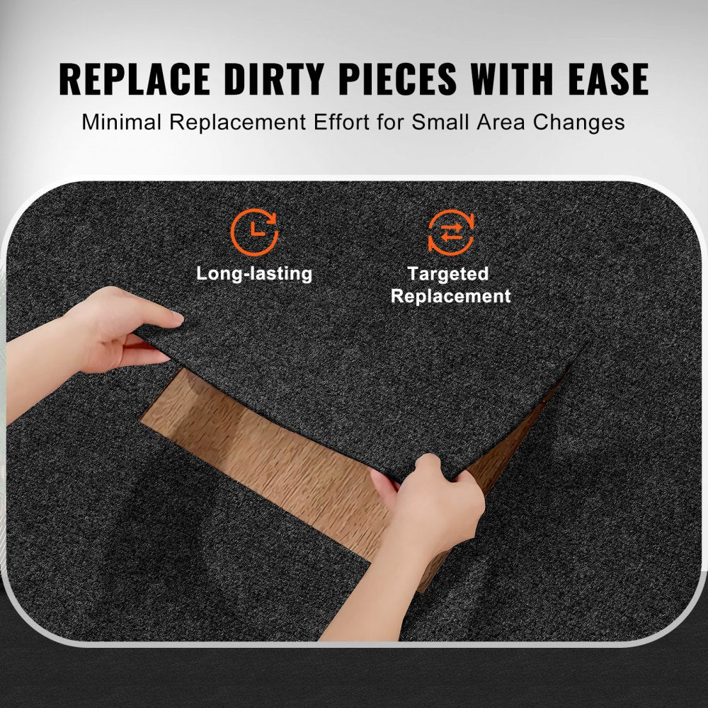 Hands lifting a black peel-and-stick carpet tile to reveal wood floor underneath for easy replacement.